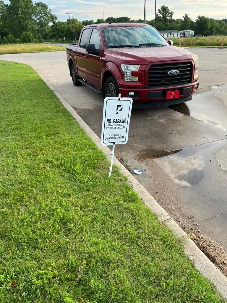 Zoey's truck parked next to a No Parking sign